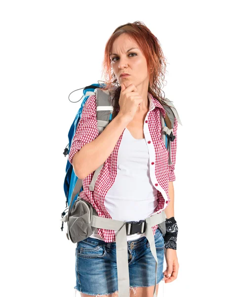 Backpacker thinking over isolated white background — Stock Photo, Image