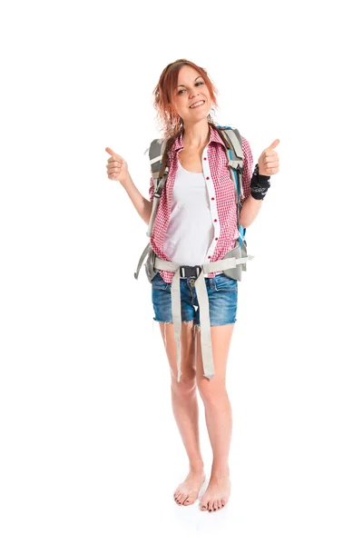 Backpacker with thumb up over white background — Stock Photo, Image