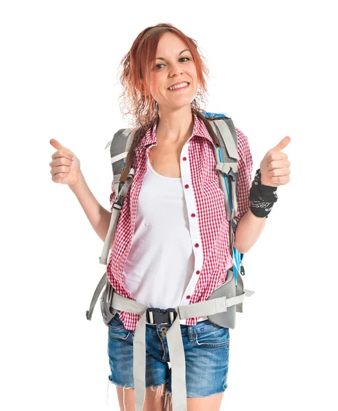 Backpacker with thumb up over white background — Stock Photo, Image