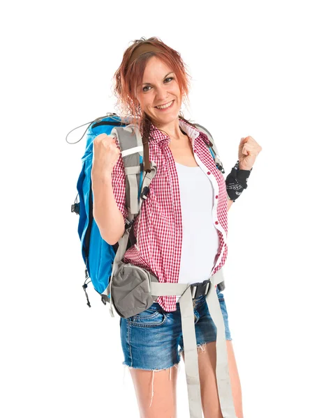 Lucky backpacker over isolated white background — Stock Photo, Image