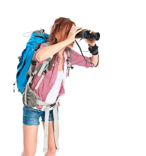 Flickan tittar genom kikare över vit bakgrund — Stockfoto