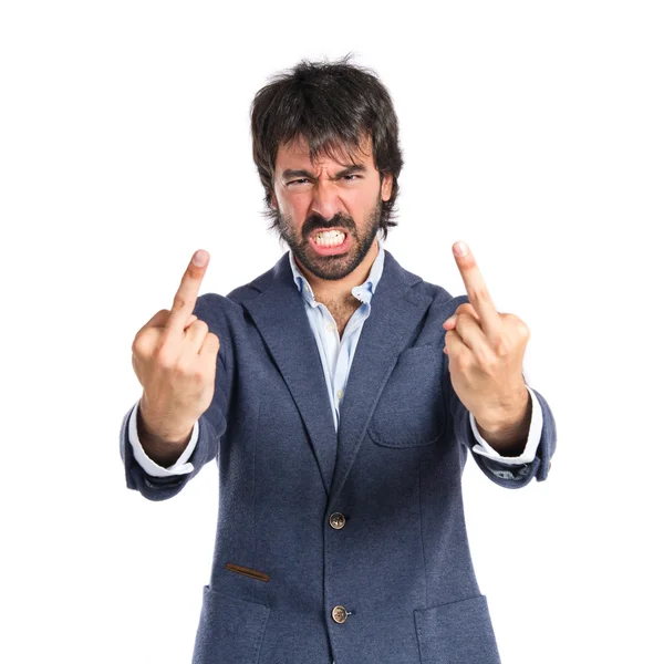 Hombre de negocios haciendo gesto cuerno sobre fondo blanco — Foto de Stock