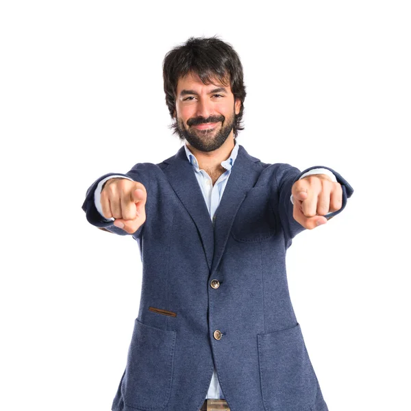 Empresario apuntando al frente sobre fondo blanco — Foto de Stock