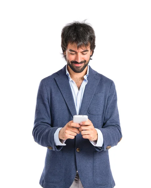 Brunetteman hablando con móvil sobre fondo blanco — Foto de Stock