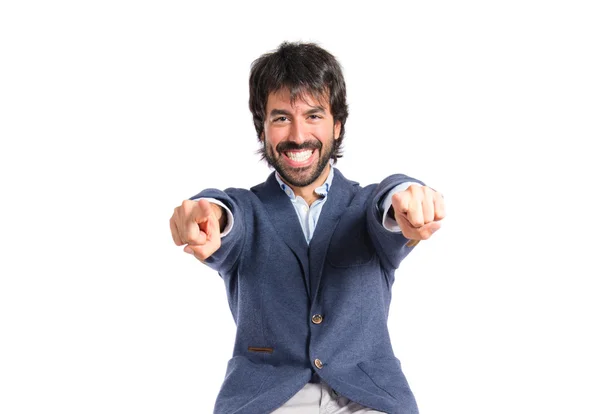 Businessman pointing to the front over white background — Stock Photo, Image