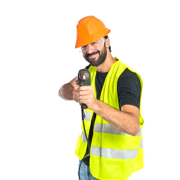 Arbeiter mit Bohrer auf weißem Hintergrund — Stockfoto