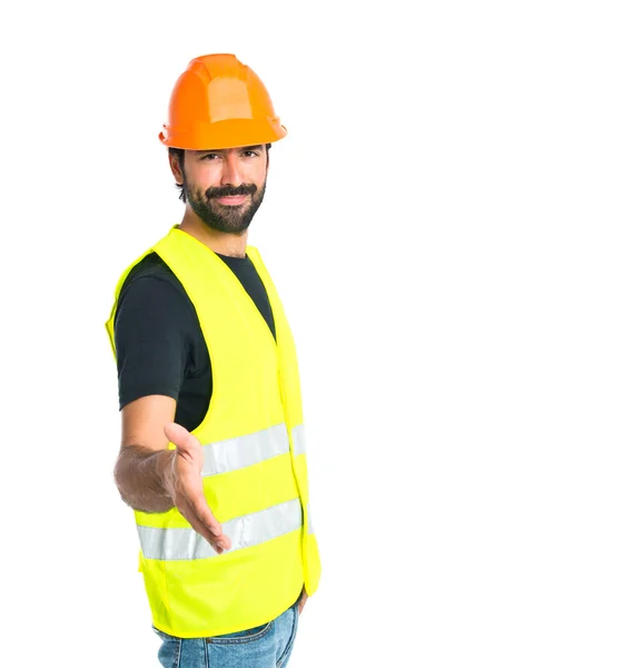 Workman making a deal over isolated white background — Stock Photo, Image