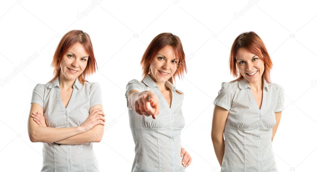 Young girl pointing over white background