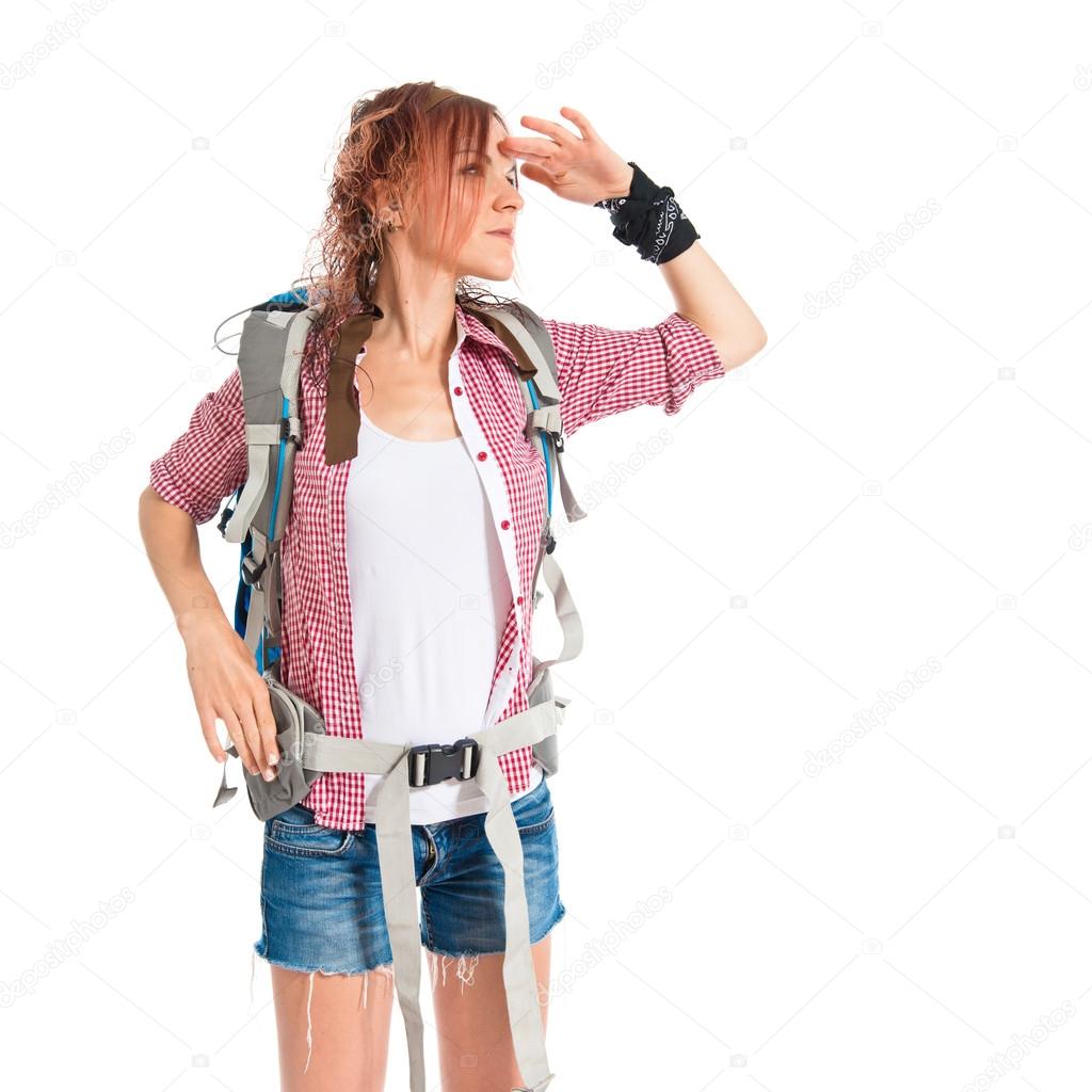 backpacker showing something over isolated white background