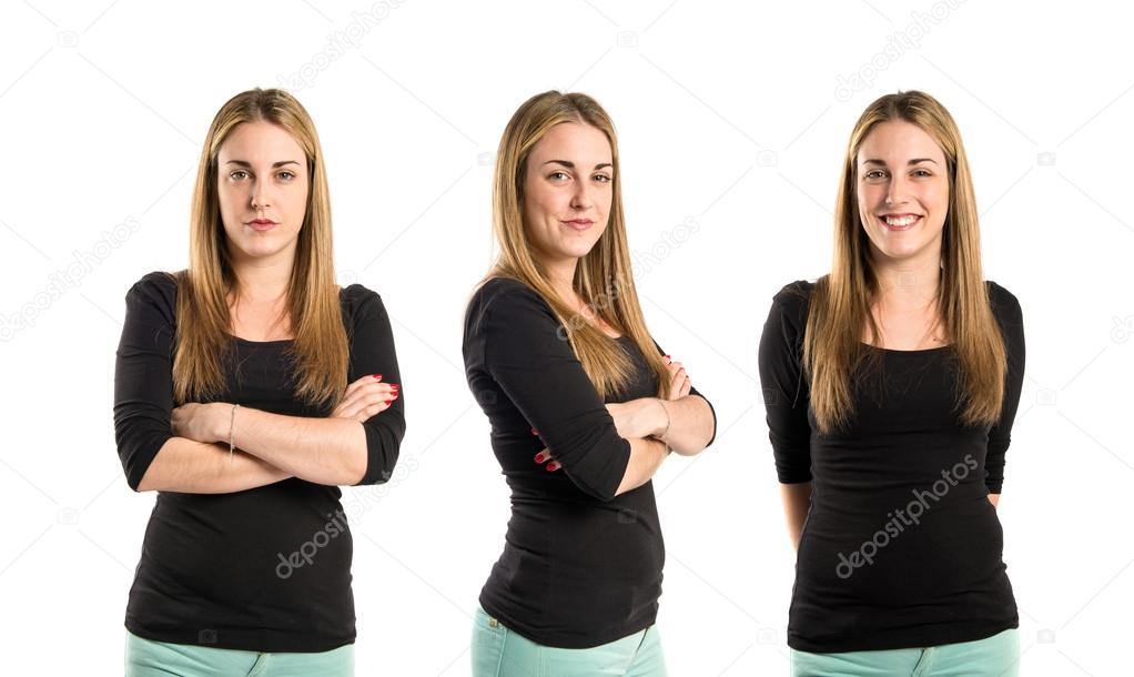 Young women with hers arms crossed over white background 