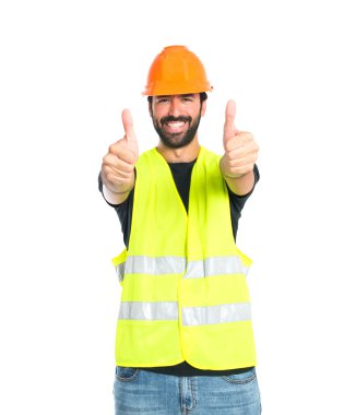Beyaz arka plan üzerinde başparmak ile işçi