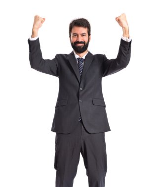 İzole beyaz arka plan üzerinde şanslı işadamı