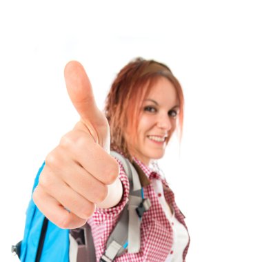 Beyaz arka plan üzerinde başparmak ile backpacker