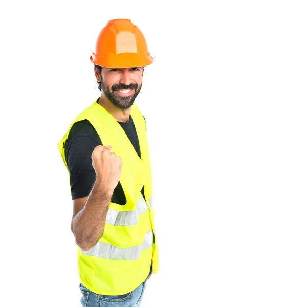 Lucky workman over isolated white background — Stock Photo, Image