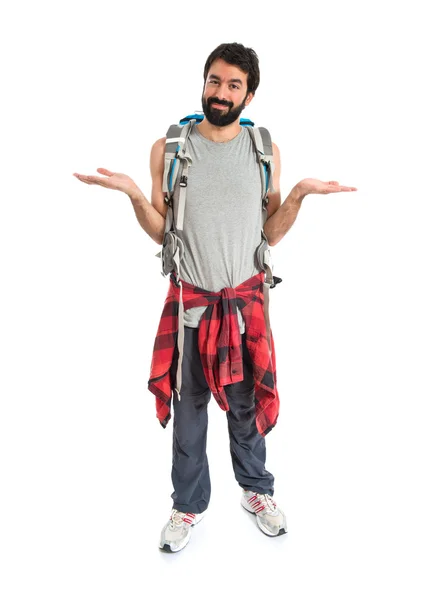 Backpacker having doubts over isolated white background — Stock Photo, Image