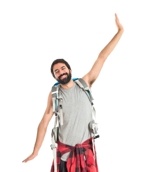 Happy backpacker over isolated white background — Stock Photo, Image