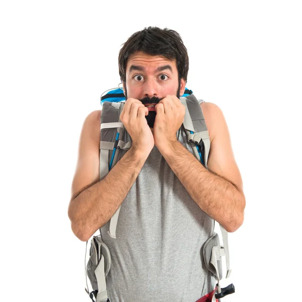 Frightened backpacker over isolated white background — 图库照片