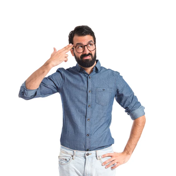 Young hipster man making gun gesture — Stock Photo, Image