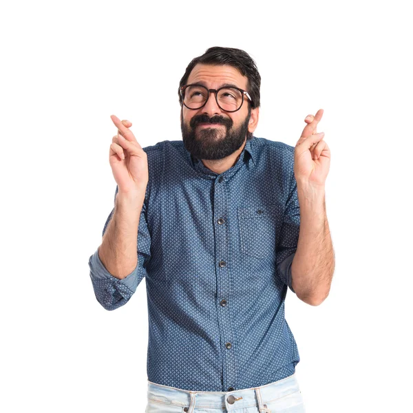 Young hipster man with his fingers crossing — Stock Photo, Image