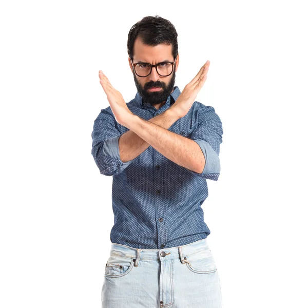 Young hipster man doing NO gesture — Stock Photo, Image