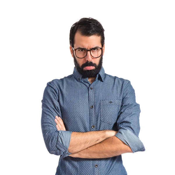 Joven hipster hombre sobre aislado blanco fondo — Foto de Stock