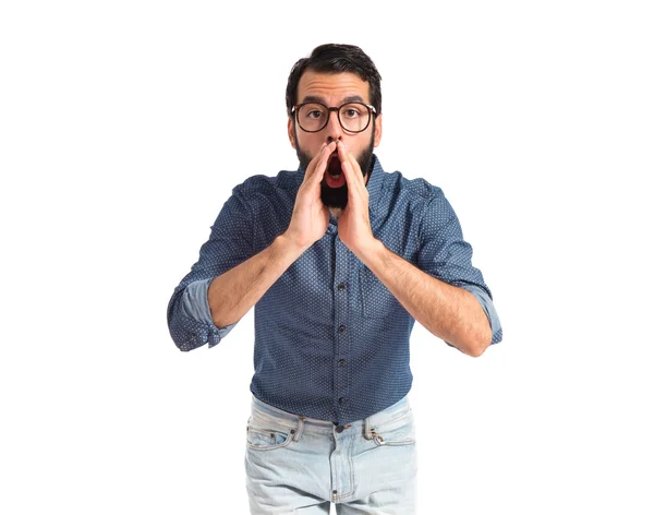 Young hipster man shouting over white background — Stock Photo, Image