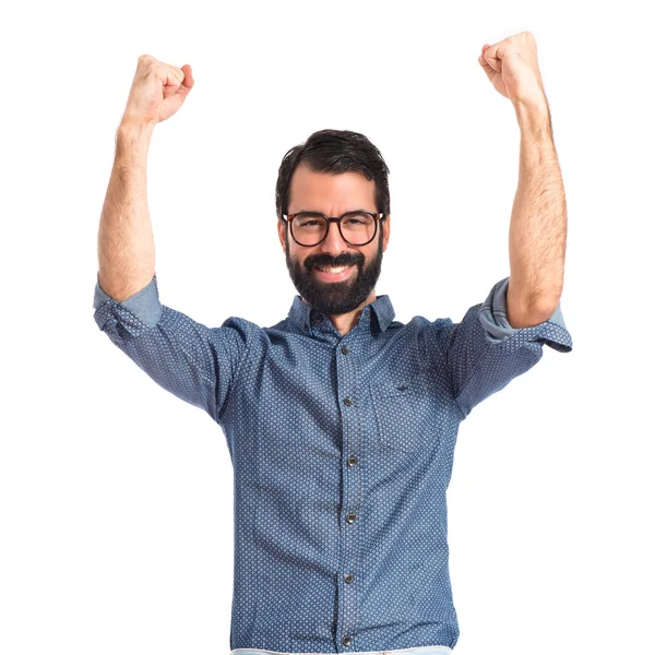 Suerte joven hipster hombre sobre fondo blanco —  Fotos de Stock