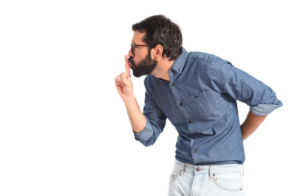 Jonge hipster man maakt stilte gebaar — Stockfoto