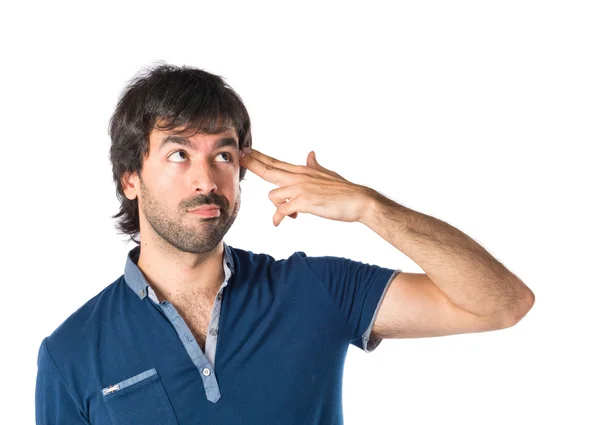 Man making suicide gesture over white background — Stock Photo, Image