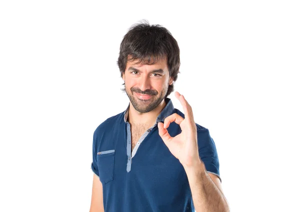 Man making Ok sign over white background — Stock Photo, Image