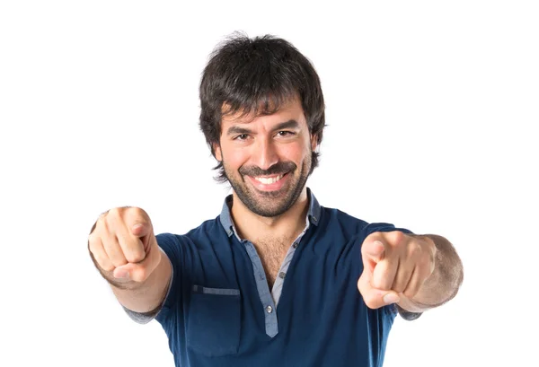 Man pointing to the front over white background — Stock Photo, Image