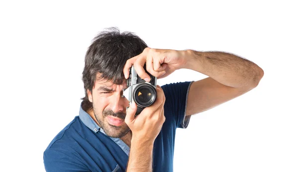 Hombre fotografiando sobre fondo blanco — Foto de Stock