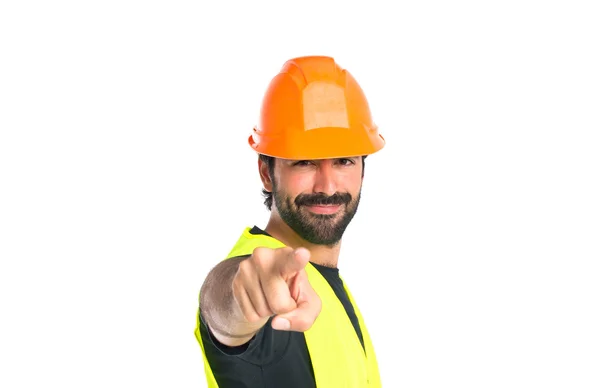 Trabajador señalando hacia el frente sobre fondo blanco — Foto de Stock