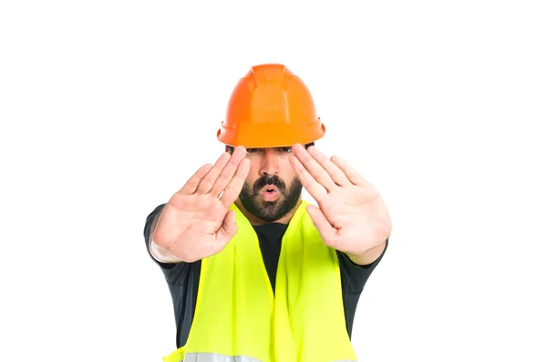 Workman making stop sign over white background — Stock Photo, Image
