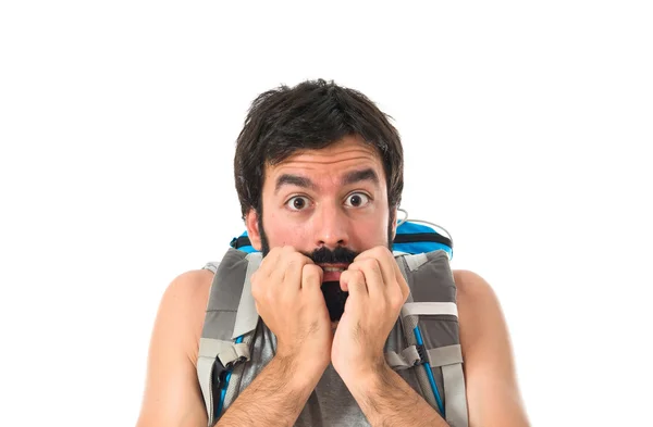 Frightened backpacker over isolated white background — 图库照片