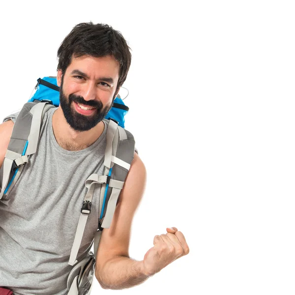 Glück Backpacker über isolierten weißen Hintergrund — Stockfoto