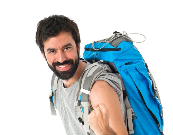 Glück Backpacker über isolierten weißen Hintergrund — Stockfoto