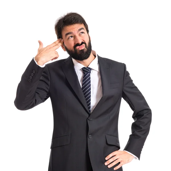 Empresario haciendo gesto de arma sobre fondo blanco — Foto de Stock