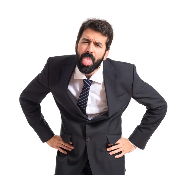 Businessman doing a joke over isolated white background — Stock Photo, Image