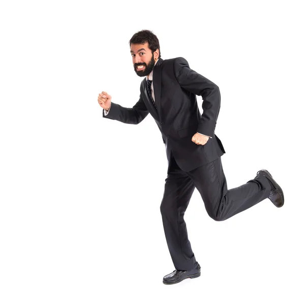 Businessman running fast over white background — Stock Photo, Image