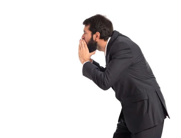 Businessman shouting over isolated white background — Stock Photo, Image