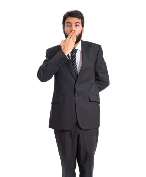 Empresario haciendo gesto sorpresa sobre fondo blanco — Foto de Stock