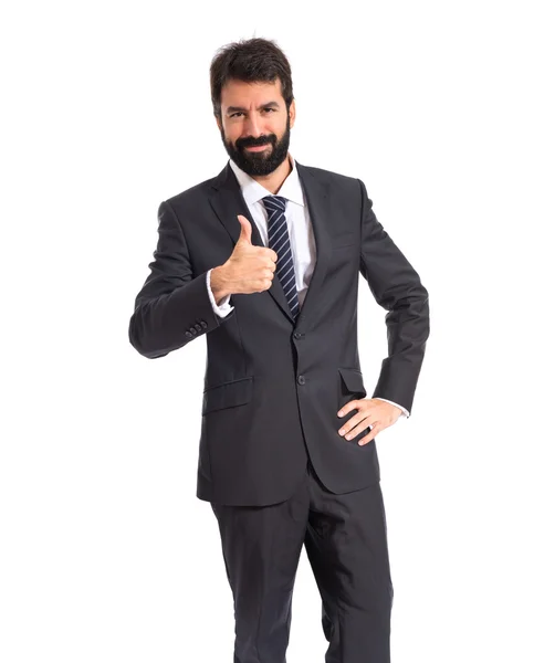 Geschäftsmann mit erhobenem Daumen über weißem Hintergrund — Stockfoto