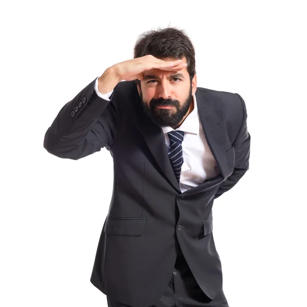Businessman showing something over white background — Stock Photo, Image