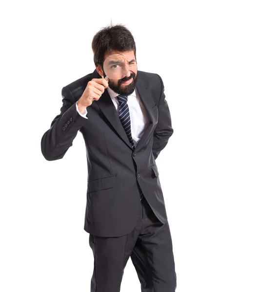 Businessman with magnifying glass over white background — Stock Photo, Image