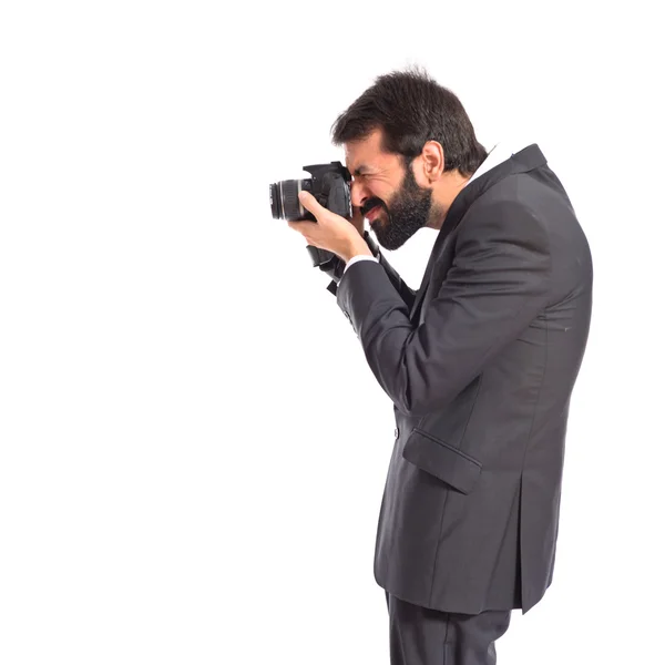 Affärsman fotografera över vit bakgrund — Stockfoto