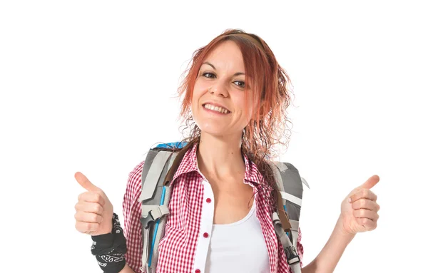 Backpacker with thumb up over white background — Stock Photo, Image