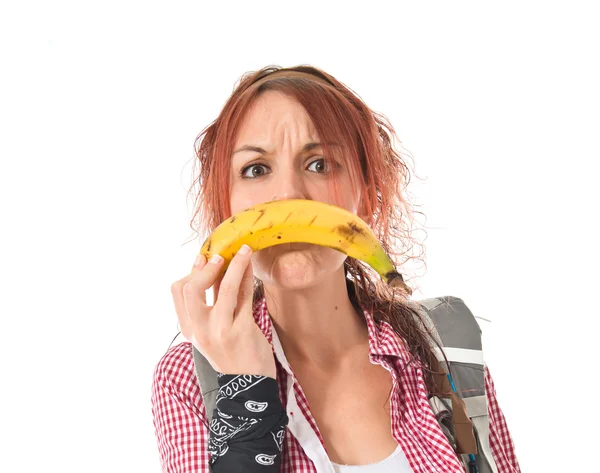Meisje triest gebaar met banan over geïsoleerde wit pagina maken — Stockfoto