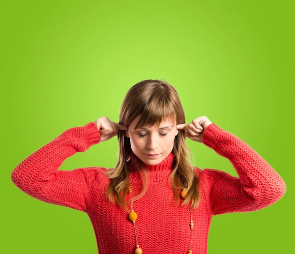 Frustrated woman over green background — Stock Photo, Image