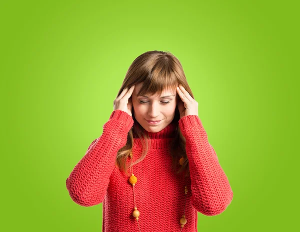 Frustrated woman over green background — Stock Photo, Image